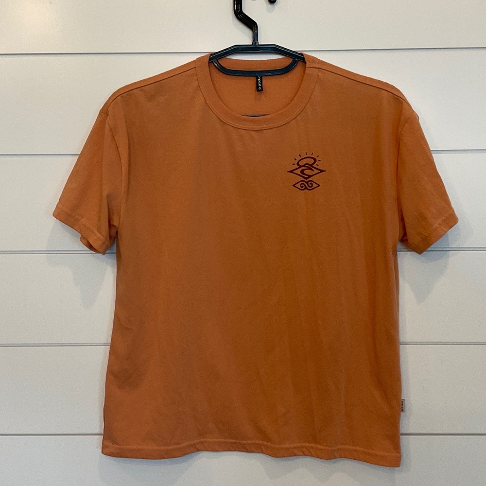 #0312 WOMEN’S RIPCURL TEE SHIRT SIZE: XSMALL COLOR; RUST
